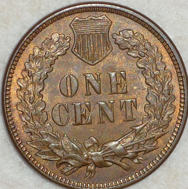Close-up of the 1875 Snow-16 Dot-on-N reverse showing raised dot on the N in ONE